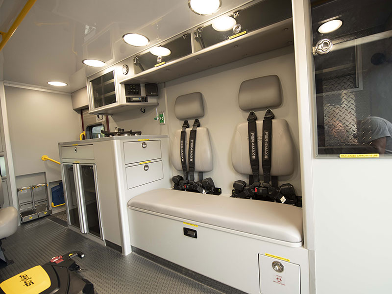 Inside of ambulance showing caginets and seats with Per4Max seatbelts