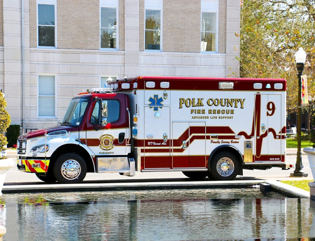 Polk County Fire Rescue ambulance by water fountain and building
