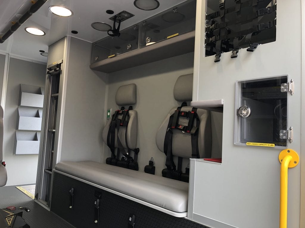 Inside of ambulance showing ambulance seats with seatbelts