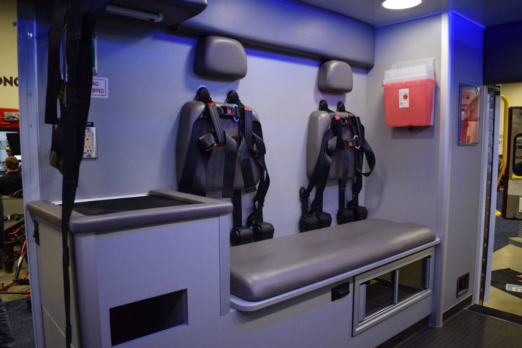 Inside view of ambulance - paramedic seat and cabinets